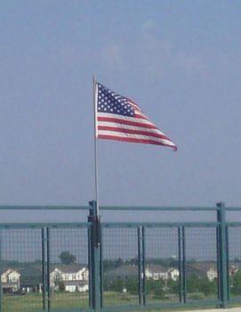 old glory on a freeway overpass