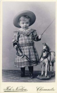 Victorian Portrait Of A Little Boy In A Dress Standing By His Toy Horse