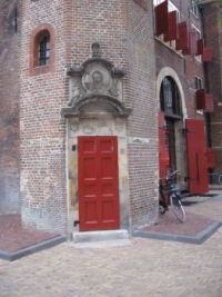 Red door of the Nieuwmarkt in Amsterdam