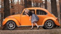 Old VW Beetle with girl