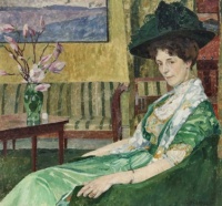 Carl Wilhelmson (Swedish, 1866–1928), Interior with a Lady in a Green Dress